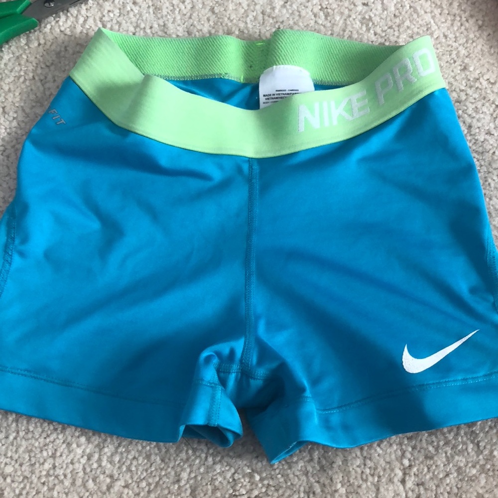 Blue and green Nike shorts